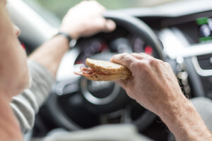 Eating while driving can be a distraction.